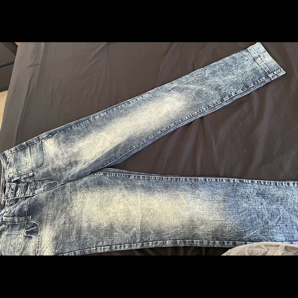Brand new distressed blue jeans